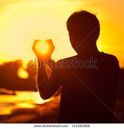 Man holding sun